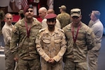 Left to right, West Virginia Army National Guard Sgt. Michael Atik, Qatari Emiri Land Forces soldier Sultan Saleh Al-Mrri and West Virginia Army National Guard Solider of the Year Spc. Dominic Starry pose for a photo in Umm Salal Muhammed, Qatar, Feb. 5, 2025. The West Virginia Army National Guard hosted its annual Best Warrior Competition in partnership with Qatar Armed Forces Feb. 2-5, 2025, at the National Service Academy in Doha, Qatar.