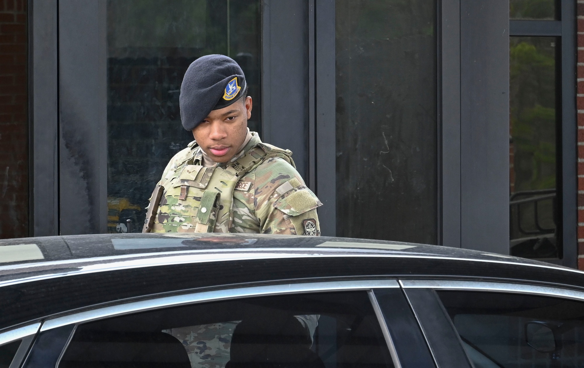An Airman checks an ID.