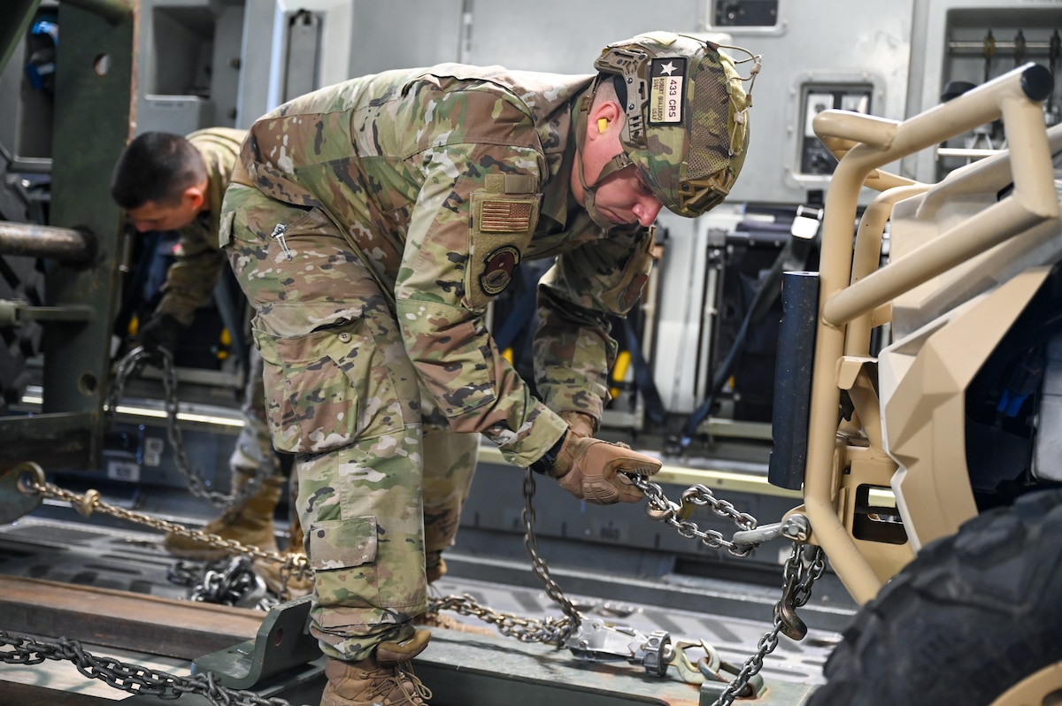 In preparation for Exercise Nexus Forge 2025, Staff Sgt. Robert Guajardo, a 433rd Contingency Response Flight port operations specialist, secures a vehicle aboard a C-17 Globemaster at Joint Base San Antonio-Lackland, Texas on Jan. 31, 2025.