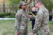 Alissa Rock is promoted to Sergeant at Fort Belvoir by Sgt. 1st Class Mark Affeltranger.