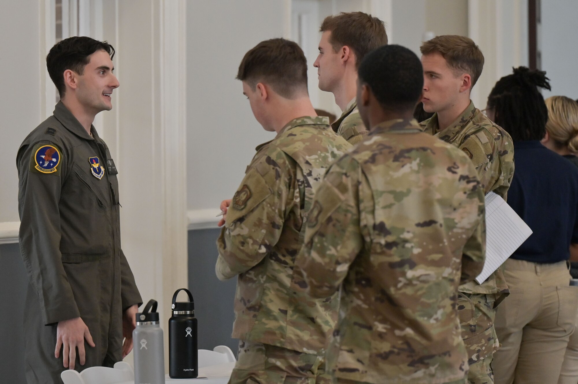 University of Mississippi Air Force Reserve Officers’ Training Corps cadets talk with a Columbus Air Force Base student pilot