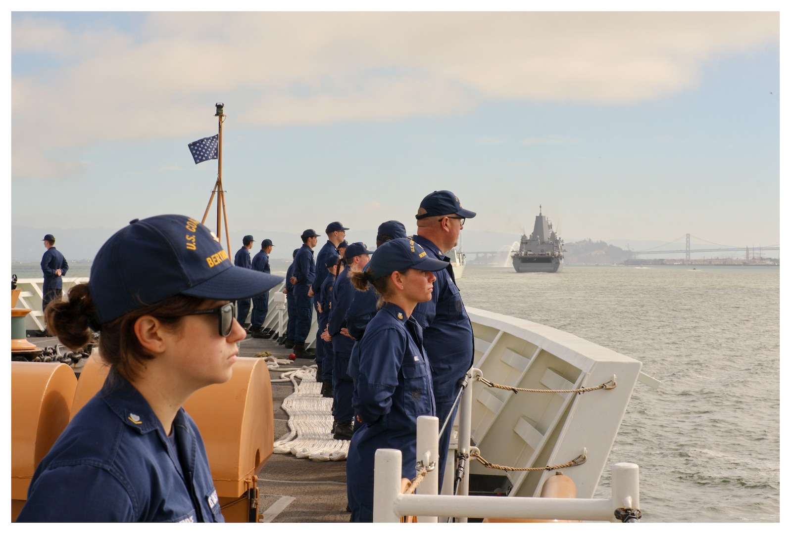 Coast Guard Cutter Bertholf (WMSL 750) crew members stand at parade rest as the cutter transits the San Francisco Bay, Oct. 11, 2024. The Bertholf represented the United States Coast Guard in the Parade of Ships as part of San Francisco’s 2024 Fleet Week festivities. (U.S. Coast Guard photo by Chief Petty Officer Jayson Merrill.)