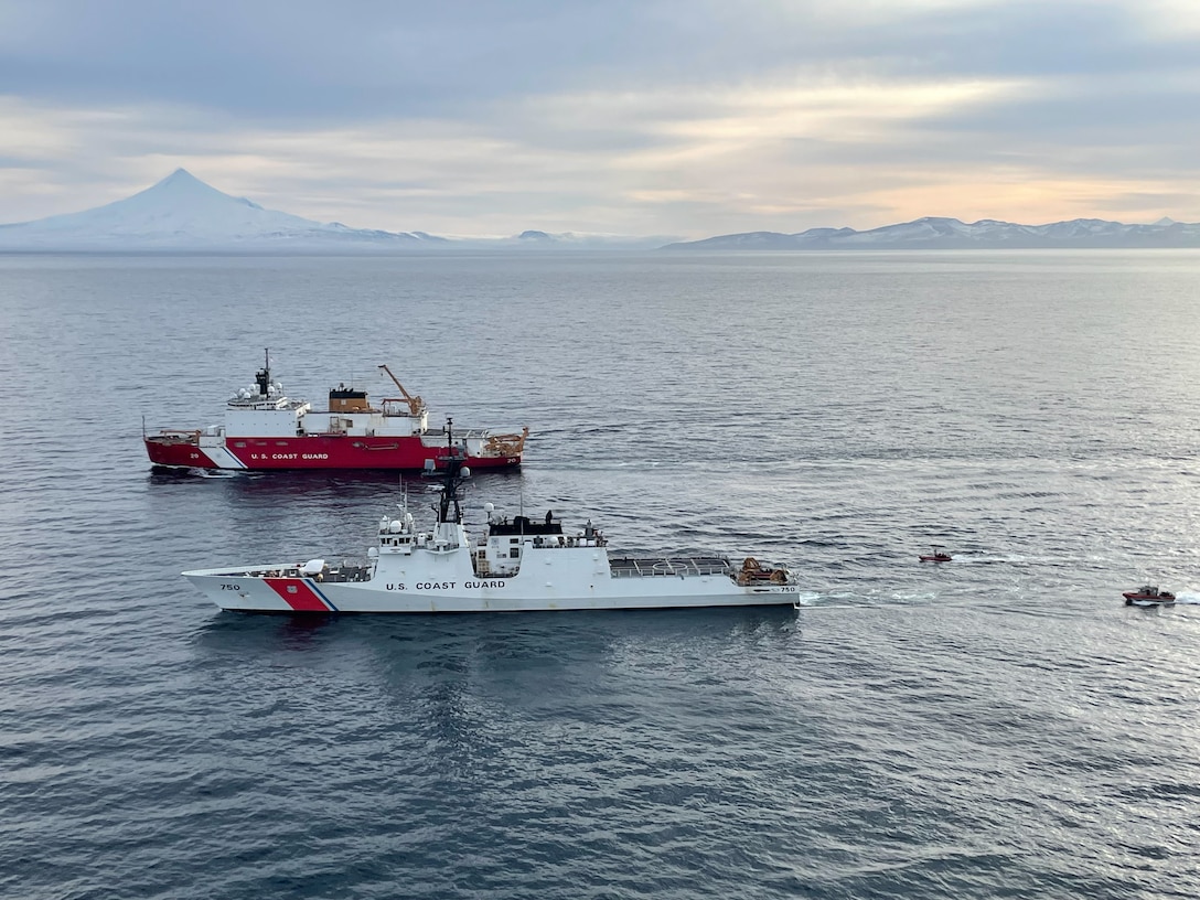 Coast Guard Cutter Bertholf (WMSL 750) and Coast Guard Cutter Healy (WAGB 20) crews conduct a passing exercise off the coast of Unimak Island, Alaska, Nov. 22, 2024. Bertholf conducted joint operations in the region with the Coast Guard Cutter Healy and Air Station Kodiak MH-60 helicopter aircrew, enhancing collaboration and improving capabilities across the national security cutter and polar icebreaker mission sets. (U.S. Coast Guard photo by Petty Officer Second Class Joel Sprowles.)