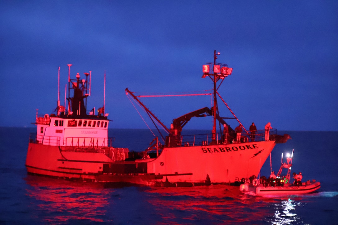 A Coast Guard Cutter Bertholf (WMSL 750) crew aboard a 26-foot over-the-horizon cutter boat brings a tow line over to the disabled Fishing Vessel Seabrooke 80 nautical miles northeast of Dutch Harbor, Alaska, Jan. 20, 2025. The Bertholf showcased the national security cutter and crew’s multi-mission agility across the region.  (U.S. Coast Guard photo by Chief Petty Officer Jayson Merrill).