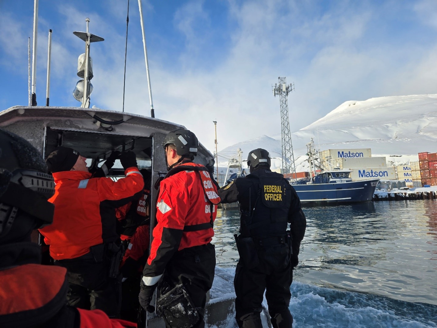 Coast Guard Cutter Bertholf (WMSL 750) crew members work with federal and state officers during a joint boarding in Akutan, Alaska, Jan. 27, 2025. The Bertholf conducted five joint boardings with National Oceanic and Atmospheric Administration (NOAA), and the Alaska Wildlife State Troopers in the vicinity. (U.S. Coast Guard photo by Lt. j.g. grade Tyler Ma).