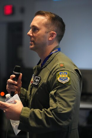 photo of US military member talking on a microphone