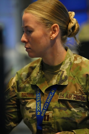 photo of US military member writes on a whiteboard