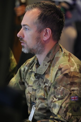photo of UK member works on a computer