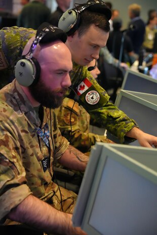 Coalition members work on computer