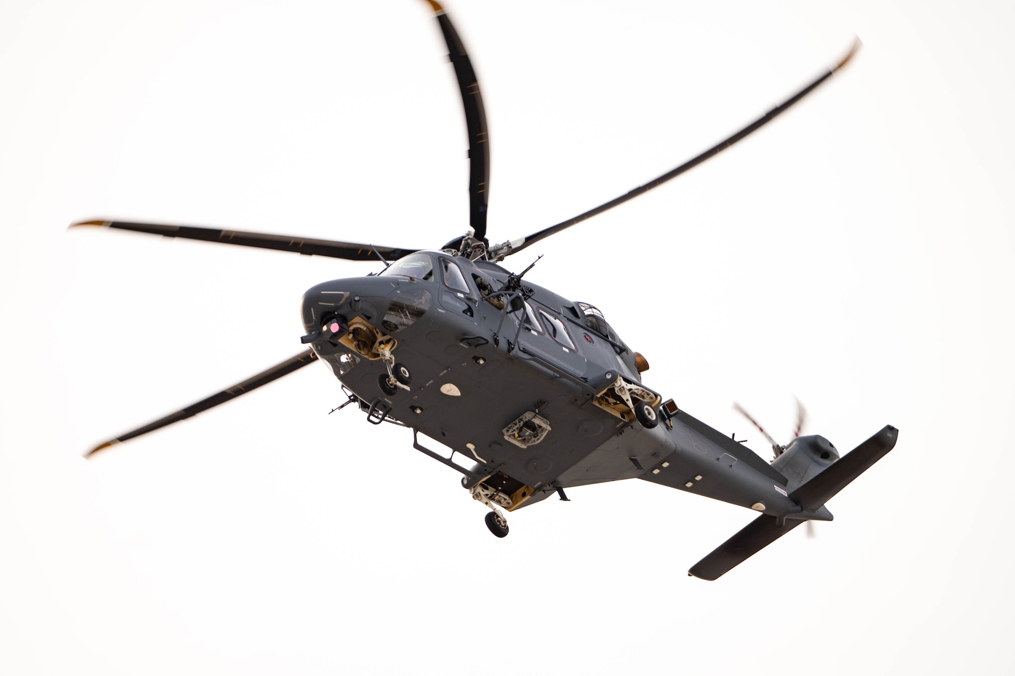 A helicopter flies overhead.