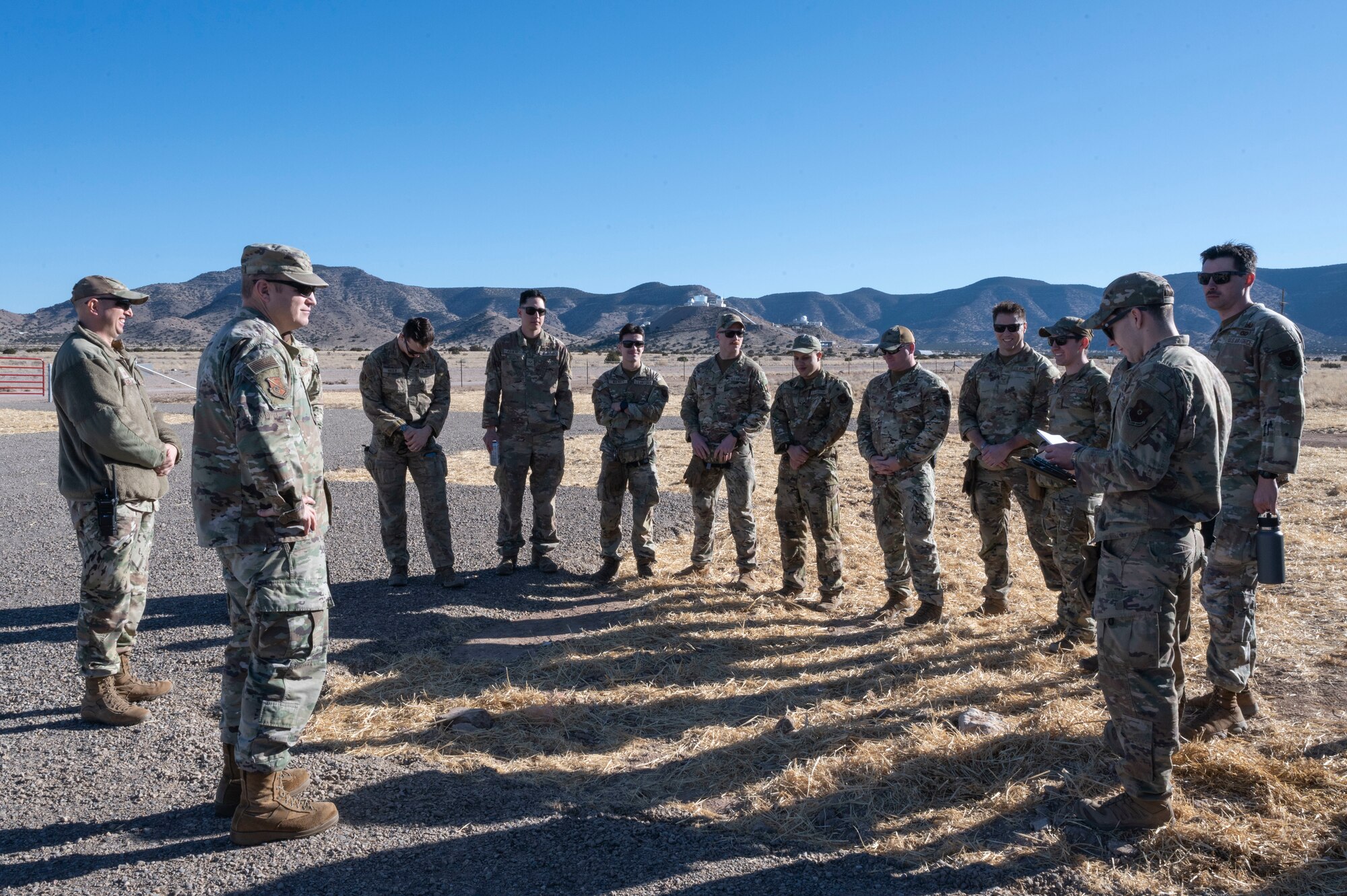 A group listens to a briefing.