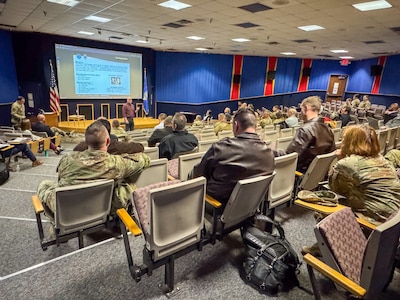 Stakeholders from across the C-5 community listen to a briefing about Defense Logistics Agency efforts to improve part availability as part of a “Drive to 55” campaign event at Joint Base San Antonio-Lackland, Texas on Jan. 14, 2025.