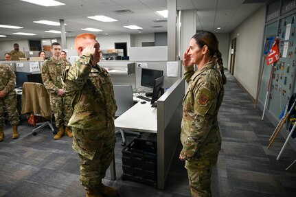 Brig. Gen. Kristin A. Hillery, Mobilization Assistant to the Commander, Air Force Medical Command, exchanges a salute with Senior Airman Carlos Verdin, a 433rd Aerospace Medicine Squadron health service management representative, during her visit to the 433rd Medical Group at Joint Base San Antonio-Lackland, Texas on Jan. 11, 2025.