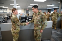 Brig. Gen. Kristin A. Hillery, Mobilization Assistant to the Commander, Air Force Medical Command, presents a commander’s coin to Master Sgt. Manuel Cordova, a 433rd Medical Squadron medical technician, during her visit to the 433rd Medical Group at Joint Base San Antonio-Lackland, Texas on Jan. 11, 2025.