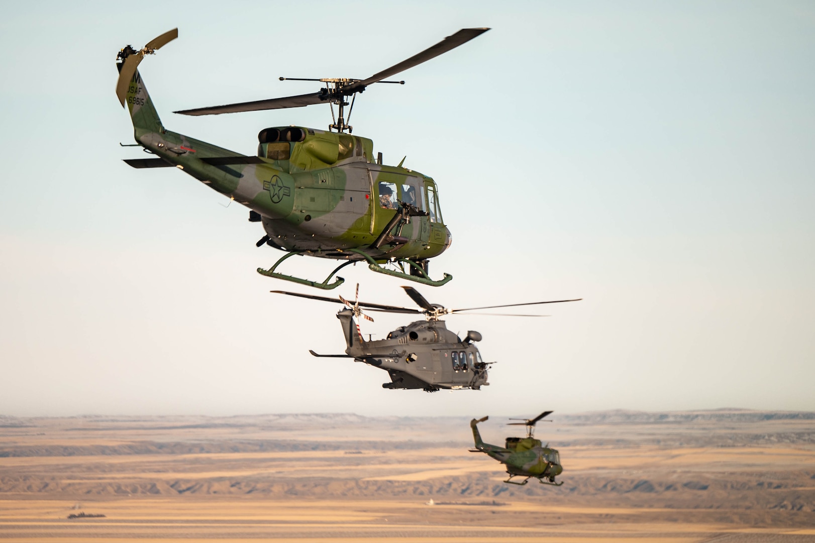 Three helicopters fly over Great Falls, MT.