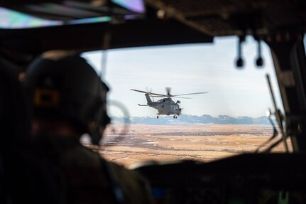 A helicopter flies over Great Falls, MT.