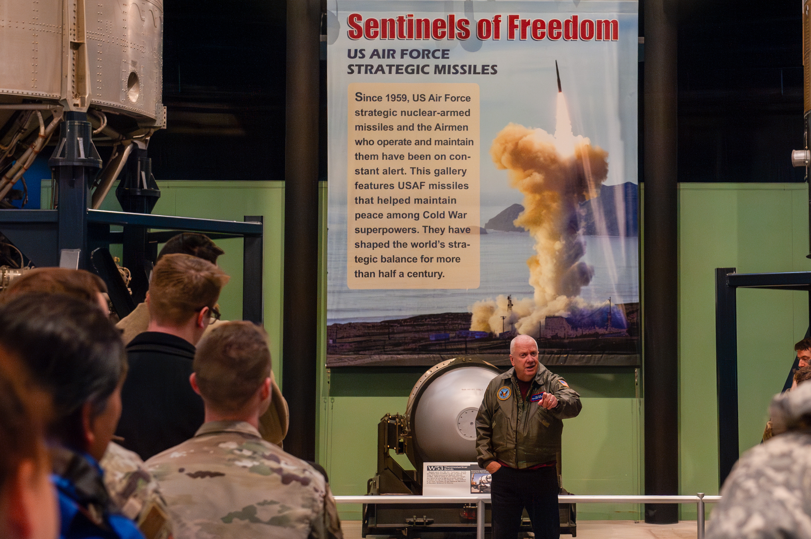 Robert Young details the history surrounding the Minuteman II (deactivated) and its successor, the Minuteman III intercontinental ballistic missiles to U.S. Air Force Institute of Technology students during a guided tour at the National Museum of the U.S. Air Force near Wright-Patterson Air Force Base, Ohio, Jan. 16, 2025. Despite the Minuteman III being approximately 300 percent more accurate than its predecessor Young takes a certain pride in the Minuteman II because he started his U.S. Air Force career as a Minuteman II Missile Launch Officer. (U.S. Air Force photo by Senior Airman Kristof J. Rixmann)