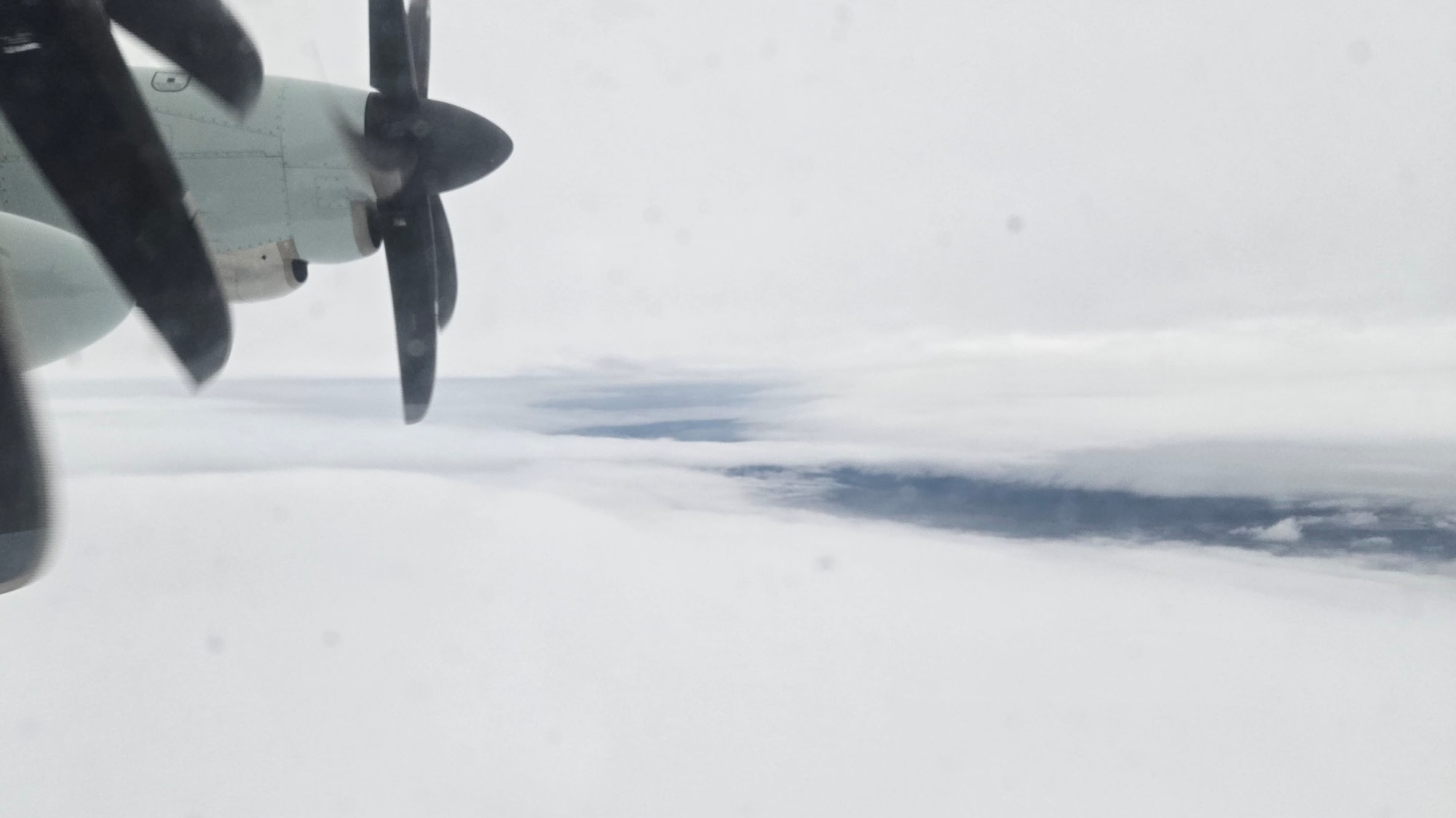 Views of clouds looking outside a WC-130J window.