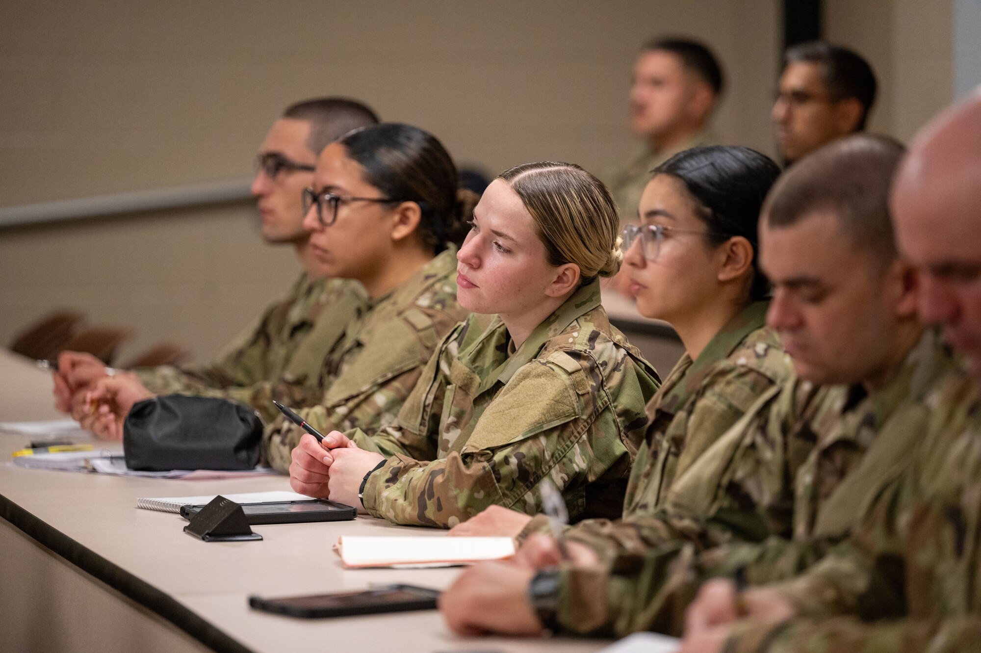 U.S. Air Force basic military trainees from the 323rd Training Squadron, listen to a guided lesson about Airmindedness during Zero Week, at Joint Base San Antonio-Lackland, Texas. The Airmindedness training encompasses various historical elements, highlighting significant achievements and milestones in Air Force history, including the stories of the Tuskegee Airmen and Women Air Service Pilots. (U.S. Air Force photo by 2nd Lt. Kate Anderson)