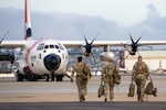 A U.S. Coast Guard C-130 Hercules crew prepares for an alien expulsion flight in San Diego, California, Feb. 9, 2025.