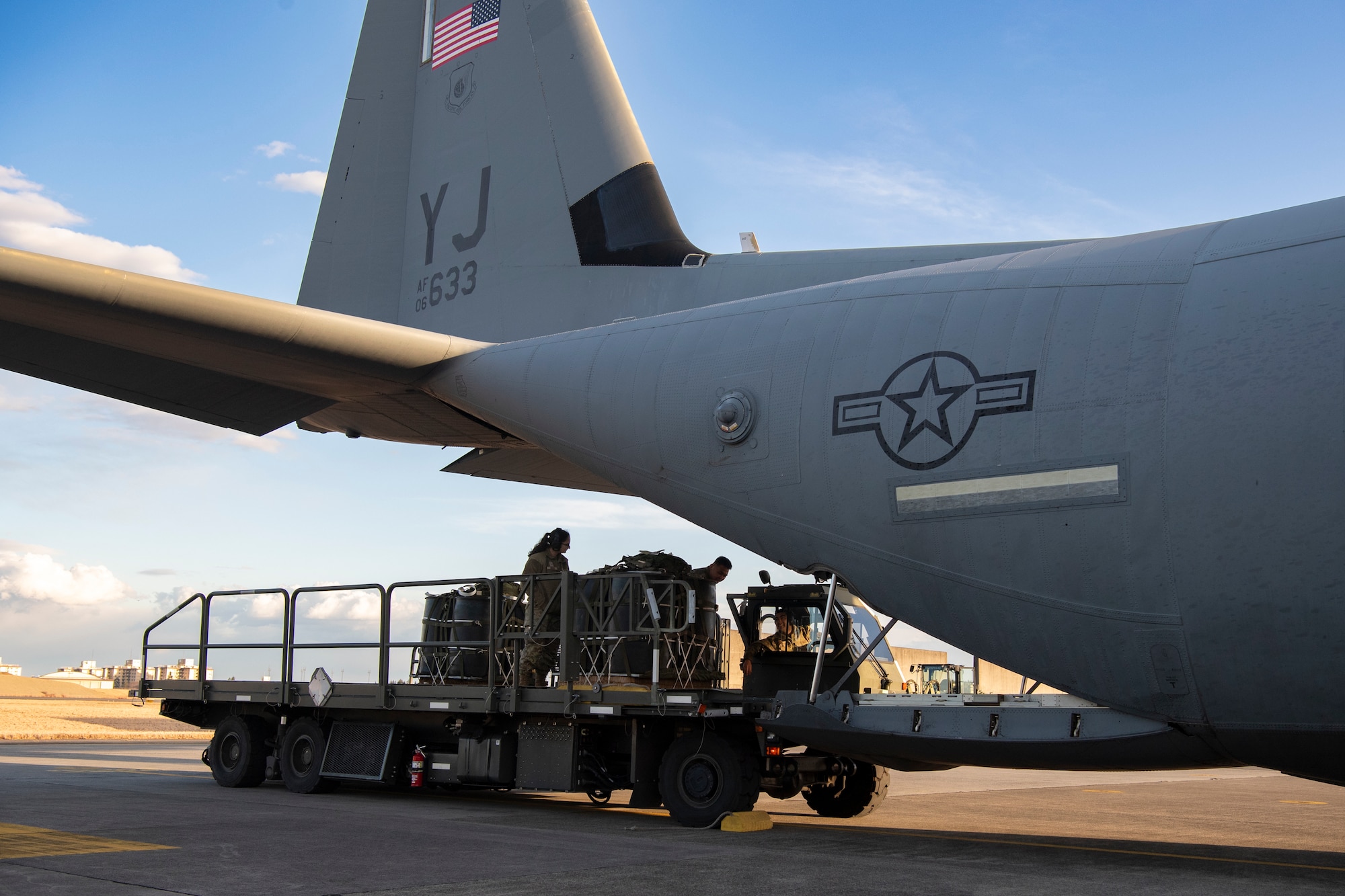 Airmen transport container delivery system bundles with a Turner 60k aircraft cargo loader onto a C-130J Super Hercules