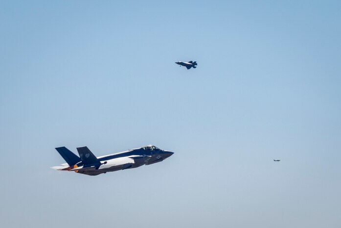 An F-35C Lightning II assigned to 3rd Marine Aircraft Wing, takes off the runway while 3rd MAW aircraft fly in the airspace over Marine Corps Air Station Miramar, California, during a Large Force Exercise (LFE) conducted by MAG-11 and MAG-13 on Jan. 15, 2025. LFE is a high-fidelity combat training event over the Southern California coast, incorporating defensive counter-air and air interdiction missions. The exercise provides pilots with invaluable experience in mission planning and execution, including opportunities to serve as division leads or mission commanders. (U.S. Marine Corps photo by Lance Cpl. Seferino Gamez)