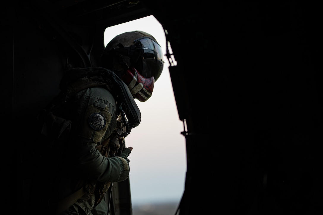 U.S. Marine Corps Staff Sgt. Nicholas Hutloff, a crew chief with Marine Medium Tiltrotor Squadron (VMM) 764, Marine Aircraft Group 41, 4th Marine Aircraft Wing, helps guide a MV-22 Osprey, tiltrotor aircraft, on Naval Air Station Joint Reserve Base New Orleans, Belle Chasse, Louisiana, Feb. 7, 2025. The Marine Corps is the lead service for Super Bowl LIX flyover, participating in multiple events throughout the week exhibiting pride leading up to the U.S. Marine Corps 250th birthday. (U.S. Marine Corps photo by Sgt. Scott Jenkins)