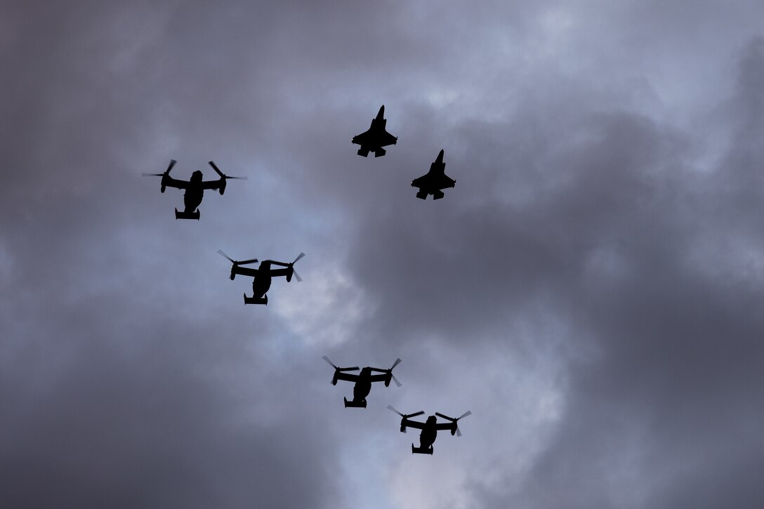 U.S. Marine Corps F-35B Lightning II aircraft with Marine Fighter Attack Squadron (VMFA) 542 and MV-22B Ospreys, tiltrotor aircraft, with Marine Medium Tiltrotor Squadron (VMM) 774 and VMM-764 perform a formation flight over New Orleans, Feb. 7, 2025. The Marine Corps is the lead service for Super Bowl LIX flyover, participating in multiple events throughout the week exhibiting pride leading up to the U.S. Marine Corps 250th birthday. (U.S. Marine Corps photo by Lance Cpl. Van Hoang)