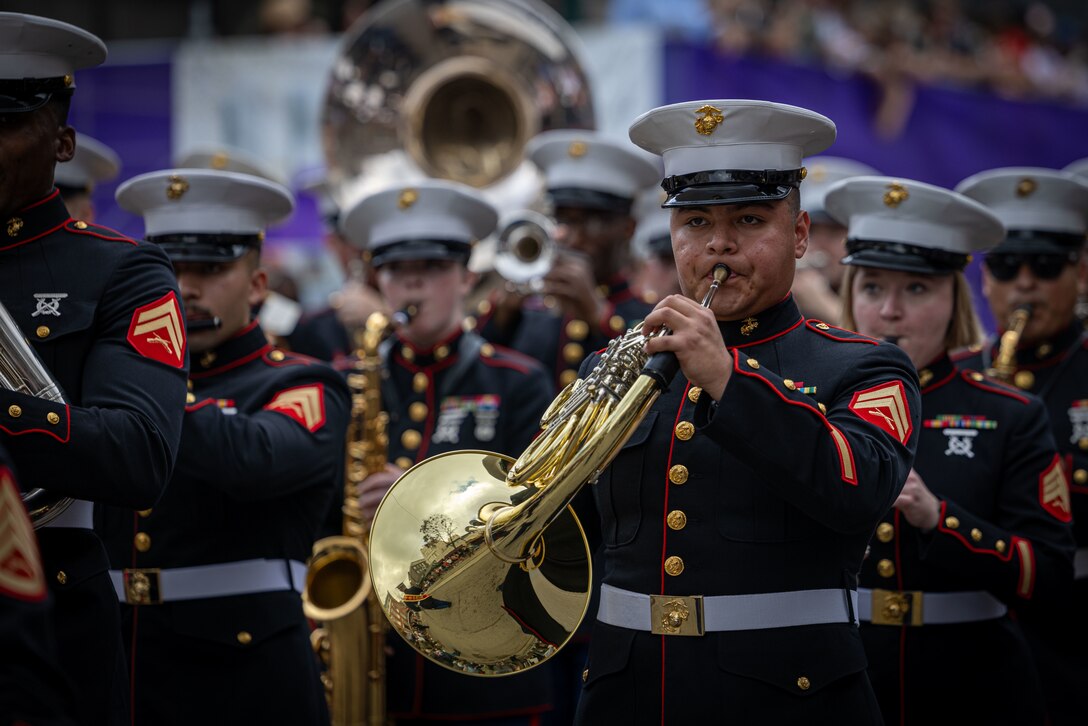 U.S. Marine Corps Cpl. Erick Izquierdo, French horn instrumentalist, Marine Forces Reserve Band, performs at the Super Bowl LIX parade in Jackson Square, New Orleans, Feb. 8, 2025. The Marine Corps is the lead service for Super Bowl LIX, participating in multiple events throughout the week exhibiting pride leading up to the U.S. Marine Corps 250th birthday. (U.S. Marine Corps photo by Lance Cpl. Juan Diaz)