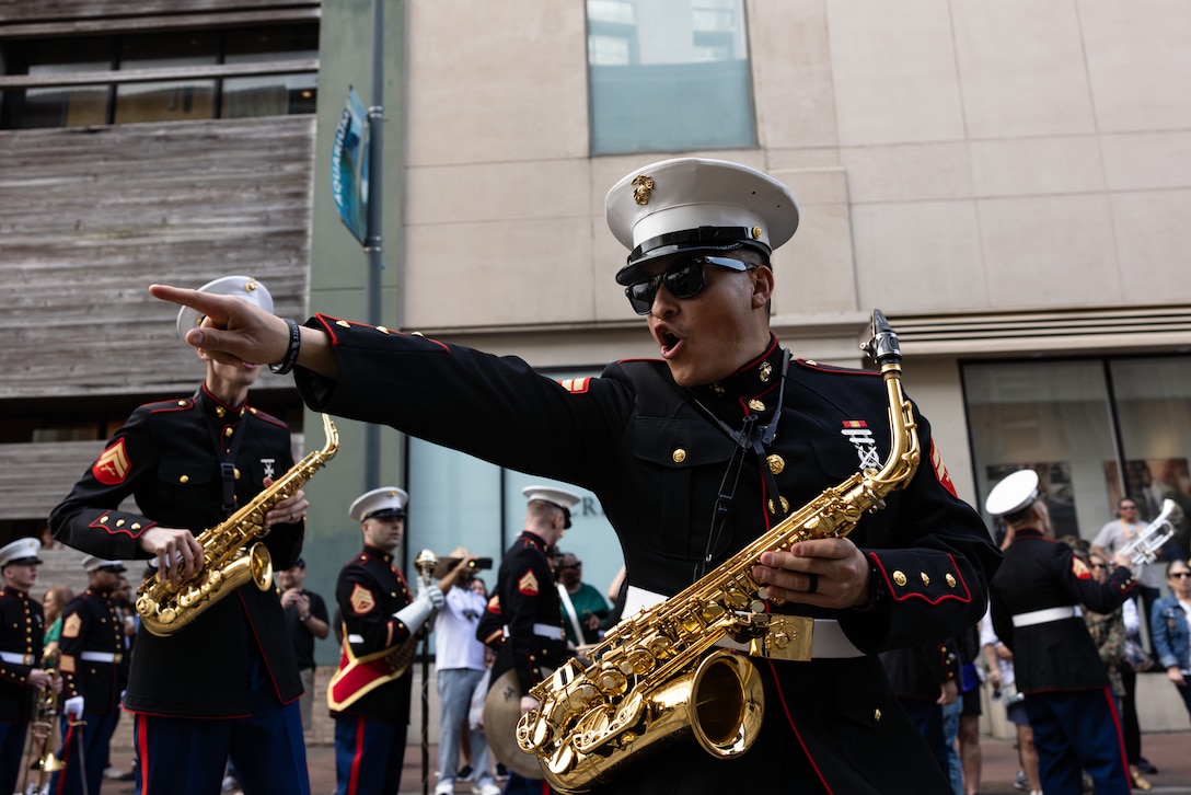U.S. Marine Corps Cpl. Abel Gonzalez, saxophone instrumentalist with the Marine Forces Reserve Band performs at the Super Bowl LIX parade in Jackson Square, New Orleans, Feb. 8, 2025. The Marine Corps is the lead service for Super Bowl LIX, participating in multiple events throughout the week exhibiting pride leading up to the U.S. Marine Corps 250th birthday. (U.S. Marine Corps photo by Sgt. Scott Jenkins)