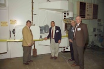 Former U.S. Naval Research Laboratory (NRL) Director of Research Dr. John Montgomery (left), NRL Mercury Project Lead Dr. Bob Commisso (center), former Plasma Physics Division Superintendent Dr. Sid Ossakow (second from right), and former Plasma Physics Division Superintendent and former Director of Research Dr. Tim Coffey (right) open the Mercury Pulsed Power Facility with a ribbon cutting ceremony at NRL-DC Headquarters in Washington, D.C., Dec. 7, 2004. For two decades, the Mercury facility remains at the forefront of pulsed power-driven beam research, providing scientists and engineers with a unique tool to study high-energy phenomena and develop innovative technologies in the realms of plasma physics, electromagnetic effects in circuits, and materials science. (U.S. Navy Photo)