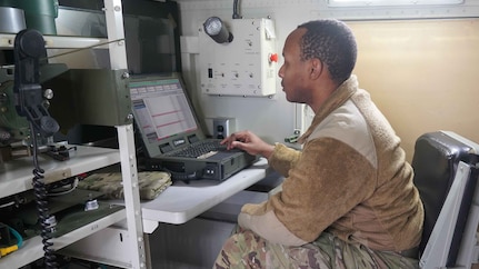Spc. Troy Miles, a radar operator with the Louisiana National Guard’s 1-141st Field Artillery Battalion, performs software upgrades for the LANG’s two AN/TPQ-53 radar systems at the Unit Training Equipment Site at Camp Villere in Slidell, Louisiana, Jan. 14, 2025.
