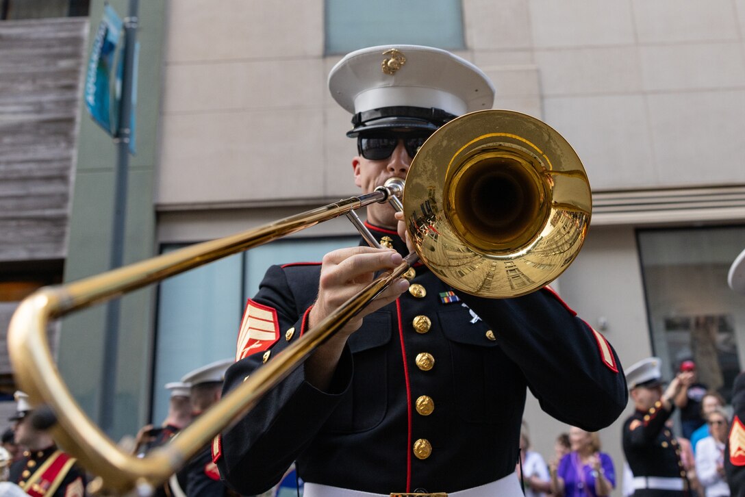 U.S. Marine Corps Sgt. Justin Napier, trombone instrumentalist with the Marine Forces Reserve Band performs at the Super Bowl LIX parade in Jackson Square, New Orleans, Feb. 8, 2025. The Marine Corps is the lead service for Super Bowl LIX, participating in multiple events throughout the week exhibiting pride leading up to the U.S. Marine Corps’ 250th birthday. (U.S. Marine Corps photo by Sgt. Scott Jenkins)