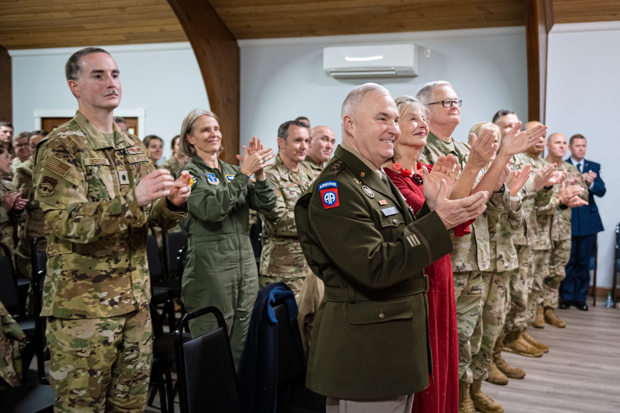 Members of the Kentucky National Guard applaud Col. Hans Otto during his retirement ceremony at the Kentucky Air National Guard Base in Louisville, Ky., Dec. 15, 2024. Otto’s career spanned 27 years across multiple assignments in the active-duty Air Force, Air Force Reserve and Air National Guard. (U.S. Air National Guard photo by Tech. Sgt. Chloe Ochs)