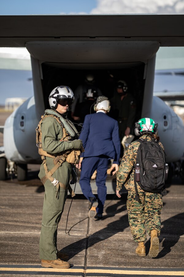 U.S. Marine Corps Sgt. Mark Hanna, a crew chief with Marine Medium Tiltrotor Squadron (VMM) 764, Marine Aircraft Group 41, 4th Marine Aircraft Wing, escorts members of the media onto a flightline, Naval Air Station Joint Reserve Base New Orleans, Belle Chasse, Louisiana, Feb. 7, 2025. The Marine Corps is the lead service for Super Bowl LIX flyover, participating in multiple events throughout the week exhibiting pride leading up to the U.S. Marine Corps 250th birthday. (U.S. Marine Corps photo by Sgt. Scott Jenkins)