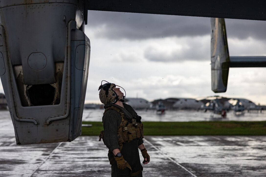 U.S. Marine Corps Maj. Nathan Sampson, a pilot with Marine Medium Tiltrotor Squadron (VMM) 774, Marine Aircraft Group 49, 4th Marine Aircraft Wing, inspects an MV-22B Osprey, tiltrotor aircraft, Naval Air Station Joint Reserve Base New Orleans, Belle Chasse, Louisiana, Feb. 9, 2025. The Marine Corps is the lead service for Super Bowl LIX flyover, participating in multiple events throughout the week exhibiting pride leading up to the U.S. Marine Corps 250th birthday. (U.S. Marine Corps photo by Sgt. Scott Jenkins)