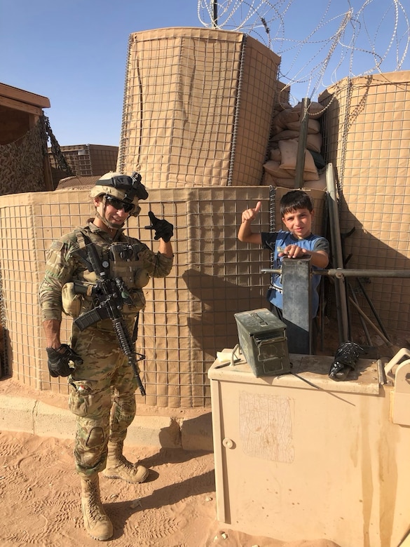 SSG Riggleman & Syrian local pose for picture