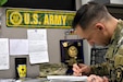 Staff Sgt. Riggleman at his desk at Harrisburg Recruiting Battalion