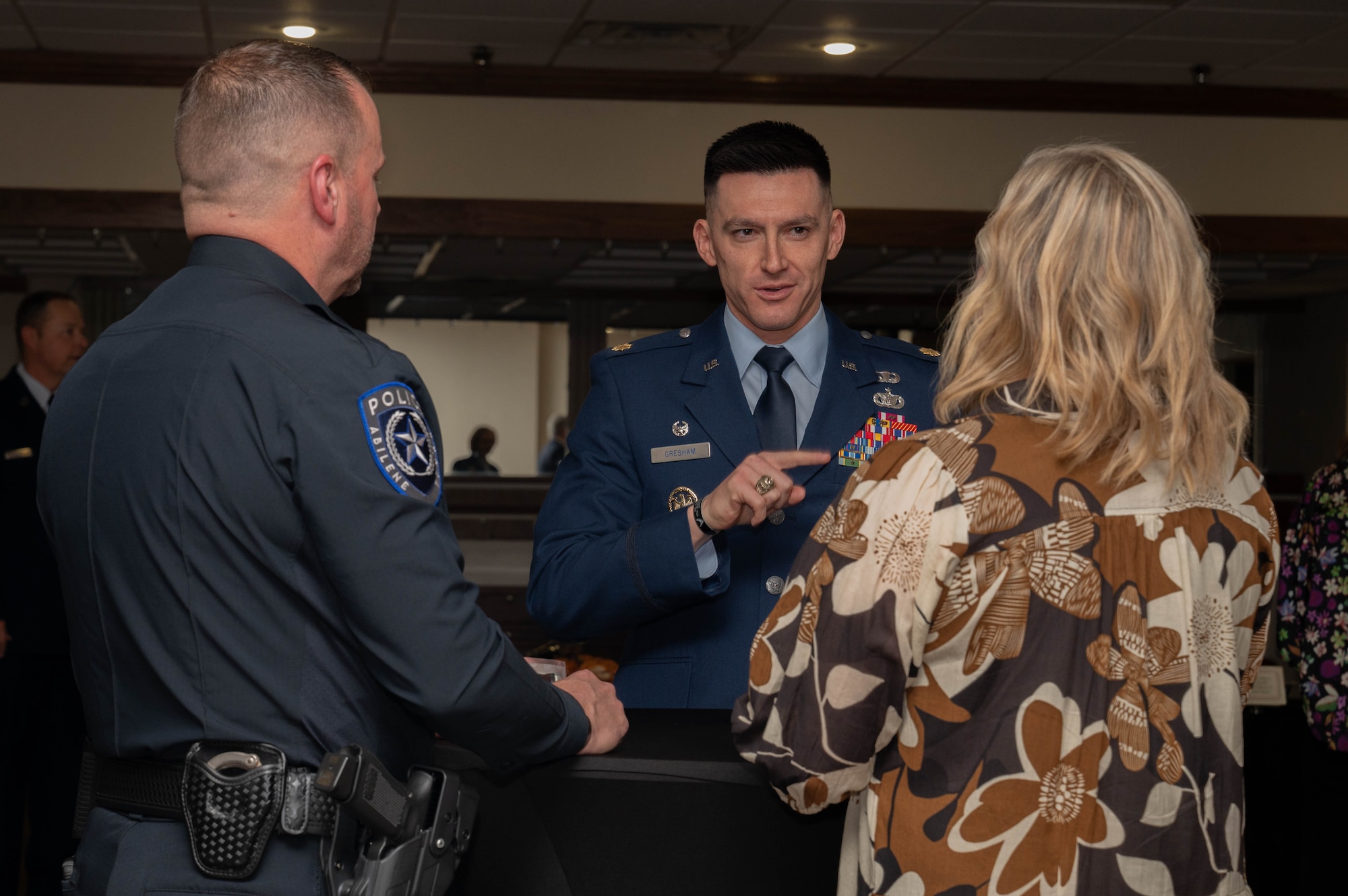 U.S. Air Force Maj. Christopher Gresham, 7th Security Forces Squadron commander, talks to his newly inducted honorary commander, Ron Seratte, Abilene Police Department chief of police, during the honorary commander induction ceremony at Dyess Air Force Base, Texas, Feb. 7, 2025. The mission of the honorary commander program is to educate key community leaders about a unit's mission and to foster a supportive relationship with the local community in addition to increasing military involvement in civic endeavors and organizations. (U.S. Air Force photo by Senior Airman Alondra Cristobal Hernandez)