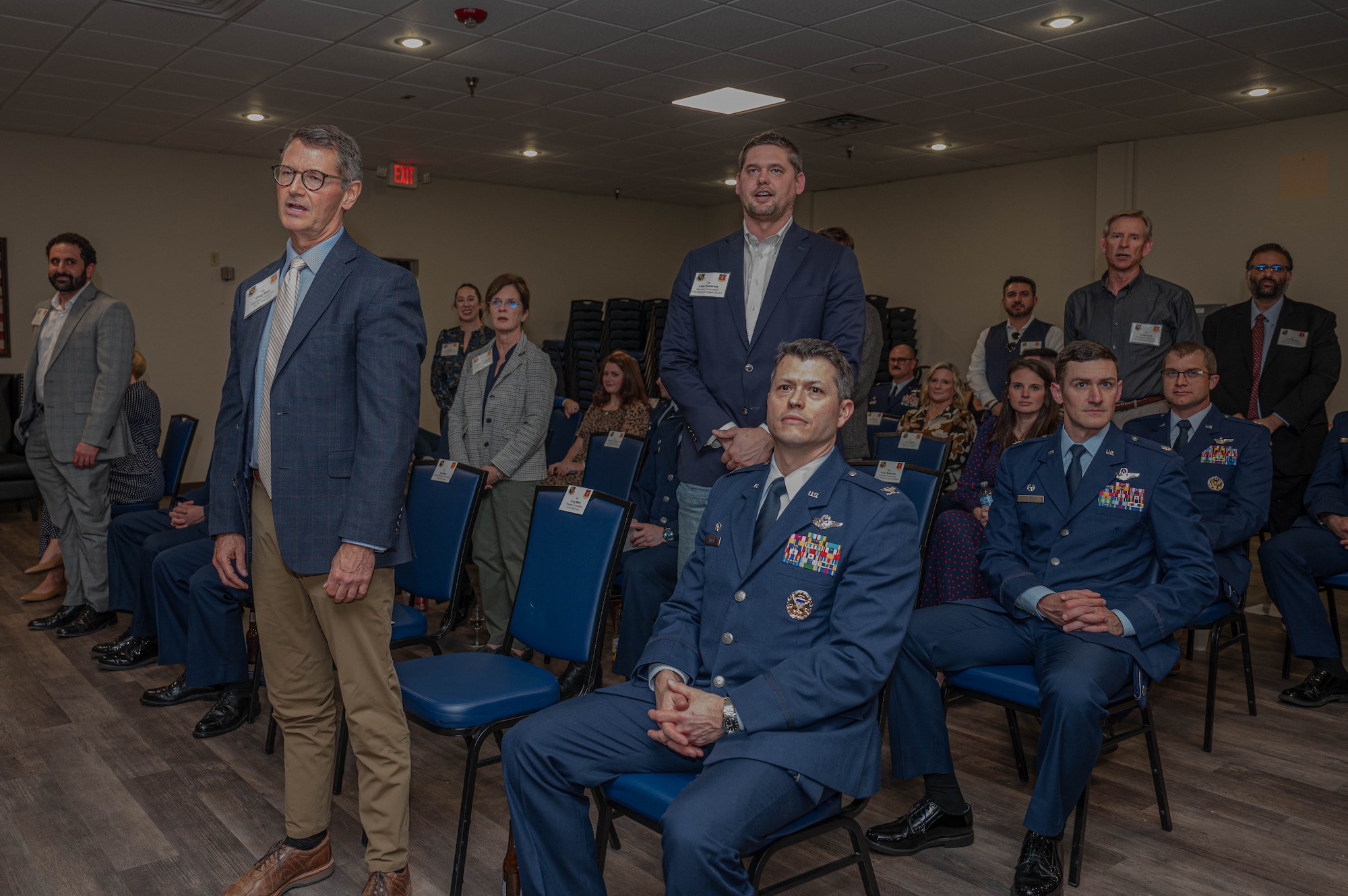 Newly inducted honorary commanders recite the honorary commander oath during an induction ceremony at Dyess Air Force Base, Texas, Feb. 7, 2025. The Dyess Honorary Commander program allows local civic leaders to learn about the mission, the U.S. Air Force and the Department of Defense. (U.S. Air Force photo by Senior Airman Alondra Cristobal Hernandez)
