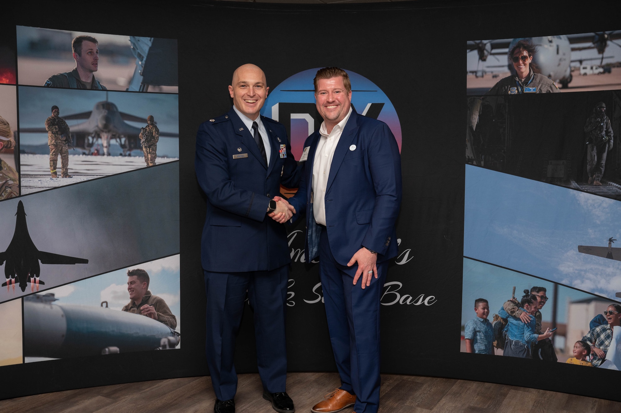U.S. Air Force Lt. Col. Thomas Synovec, 7th Civil Engineer Squadron commander, shakes hands with Mark Pulley, 7th CES honorary commander, during an induction ceremony at Dyess Air Force Base, Texas, Feb. 7, 2025. The program allows military commanders and their units to learn more about the community and enhance partnerships. (U.S. Air Force photo by Senior Airman Alondra Cristobal Hernandez)
