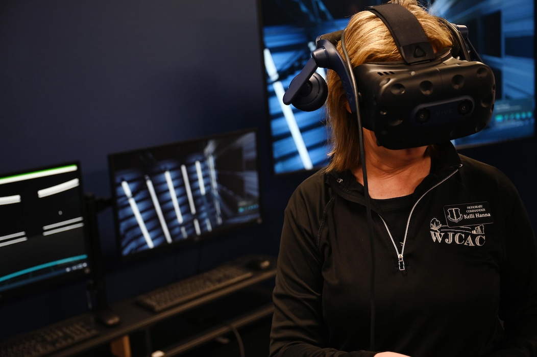 Kelli Hanna, 17th Training Wing Honorary Commander, interacts with virtual reality training equipment at the 17th Training Support Squadron’s Instructional Technology during their 17th Training Group immersion, Goodfellow Air Force Base, Texas, Feb. 6, 2025. The ITU demonstrated how instructors can effectively train students while ensuring they receive hands-on experience before entering the operational field. (U.S. Air Force photo by Senior Airman Madi Collier)