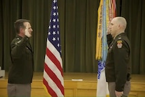 U.S. Army Cyber Center of Excellence Commanding General Ryan Janovic administers the Oath of Office to newly promoted Col. Thomas Nelson.