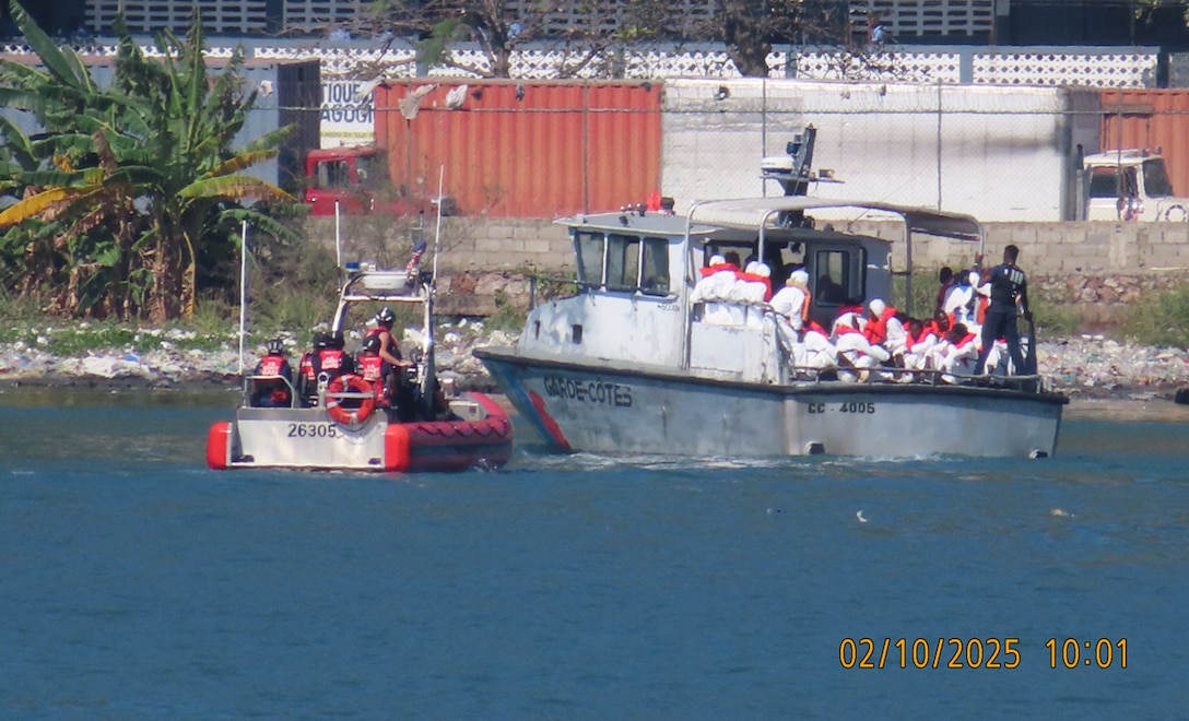 Crewmembers from the U.S. Coast Guard Cutter Escanaba transferring Haitian aliens to the Haitian Coast Guard near Cap-Haitien, Feb. 10, 2025. A total of 132 Haitian aliens were interdicted and repatriated (U.S. Coast Guard photo)