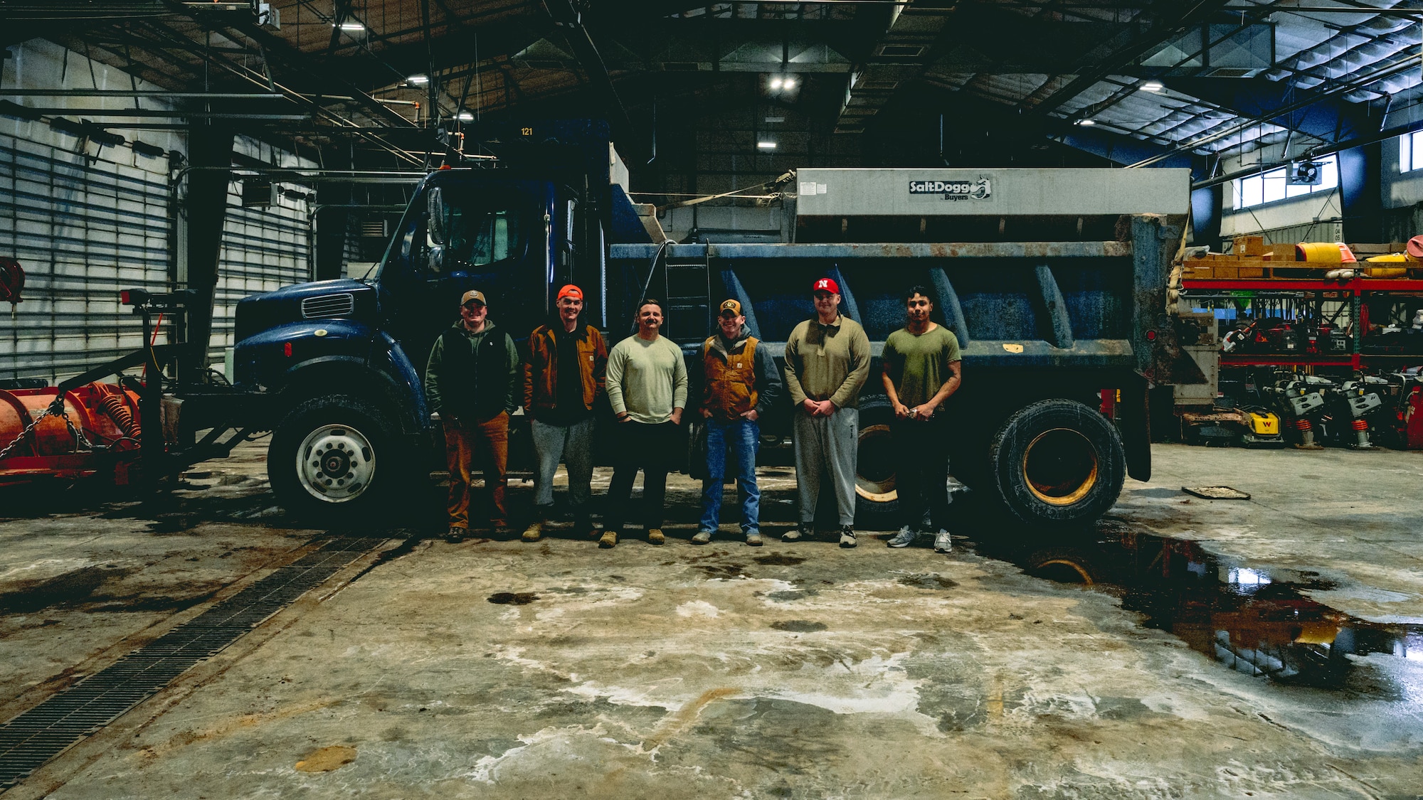 90th Civil Engineer Squadron Horizontal Repair Shop ‘Dirt Boyz’ pose for a group photo at F.E. Warren Air Force Base, Wyoming, Jan. 25, 2025. The Dirt Boyz operate heavy equipment to clear snow from roads and key infrastructure, ensuring base personnel safety and maintaining access to critical facilities to support the 90th Missile Wing's nuclear deterrence mission despite severe winter conditions. (U.S. Air Force photo by Staff Sgt. Michael A. Richmond)