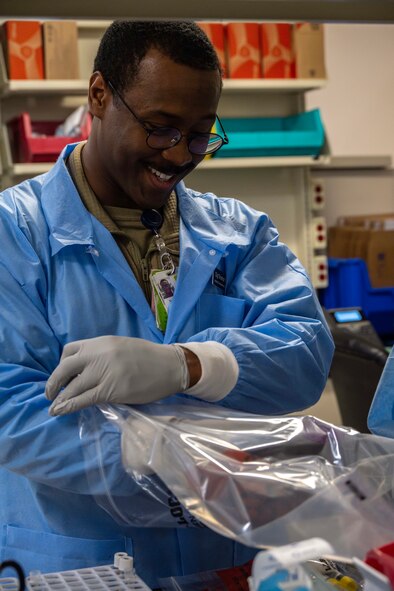 U.S. Air Force Staff Sgt. Shamar Young, 5th Medical Operations Squadron laboratory technician, prepares blood specimens for shipment at Minot Air Force Base, North Dakota, Jan. 29, 2025. The blood specimens are collected at Minot AFB and then shipped offsite to be tested. (U.S. Air Force photo by Senior Airman Alyssa Bankston)