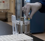 Katrina Schoeberl, 5th Medical Operations Squadron technician supervisor, sets up samples at Minot Air Force Base, North Dakota, Jan. 29, 2025. Schoeberl set up samples to calibrate the chemistry analyzer. (U.S. Air Force photo by Senior Airman Alyssa Bankston)