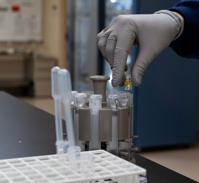 Katrina Schoeberl, 5th Medical Operations Squadron technician supervisor, sets up samples at Minot Air Force Base, North Dakota, Jan. 29, 2025. Schoeberl set up samples to calibrate the chemistry analyzer. (U.S. Air Force photo by Senior Airman Alyssa Bankston)