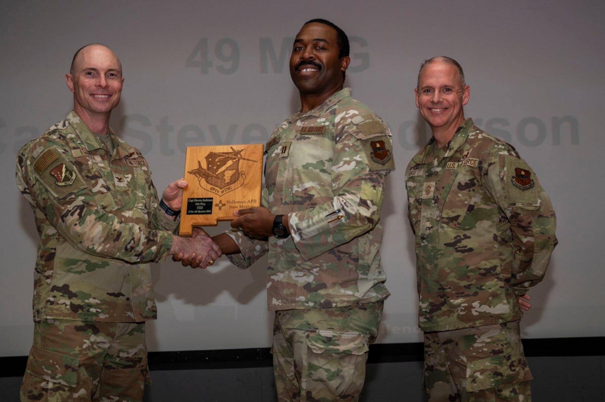U.S. Air Force Capt. Steven Anderson, from the 49th Force Support Squadron, accepts the 49th Wing Company Grade Officer of the Quarter Award, during the 49th Wing’s 4th Quarter Award ceremony at Holloman Air Force Base, New Mexico, Feb. 7, 2025. Quarterly award winners were selected based on their technical expertise, demonstration of leadership and job performance. (U.S. Air Force photo by Senior Airman Michelle Ferrari)