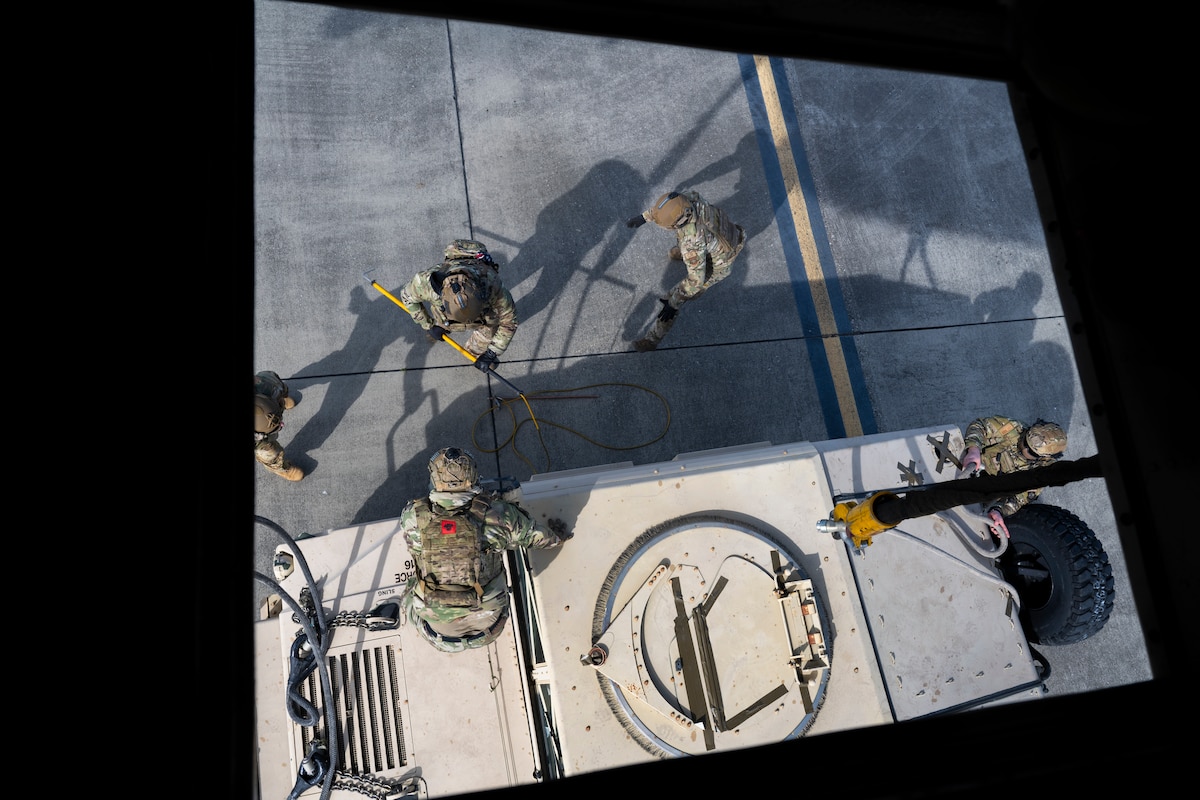 Airmen prepare Humvee for sling load